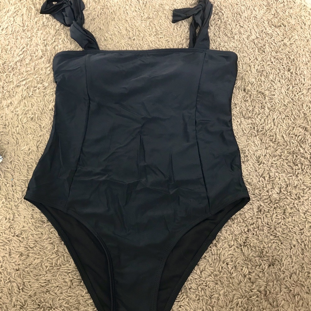 One piece black bathing suit